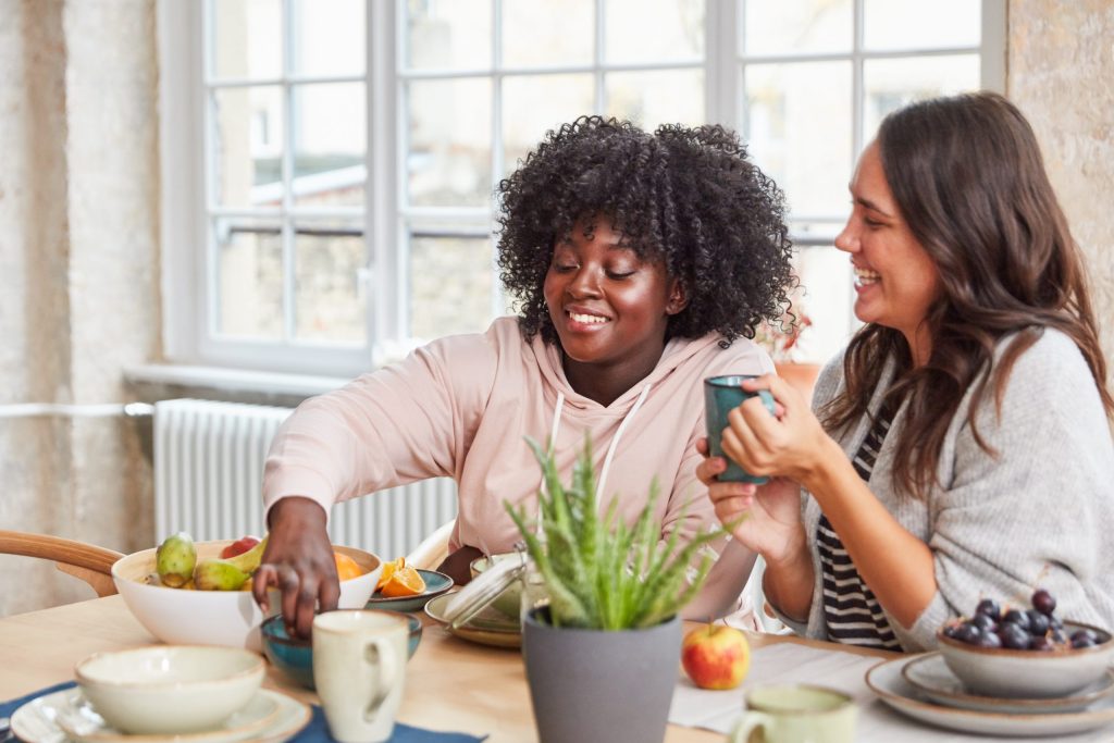 Two women eating a healthy snack