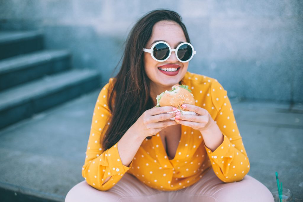 Woman eating takeout food