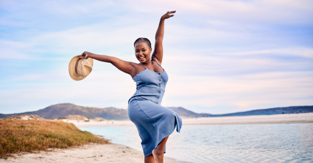 A woman on summer vacation after weight loss surgery (model)