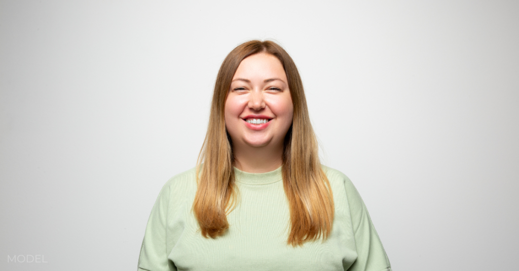 Studio portrait of a beautiful woman smiling (model)